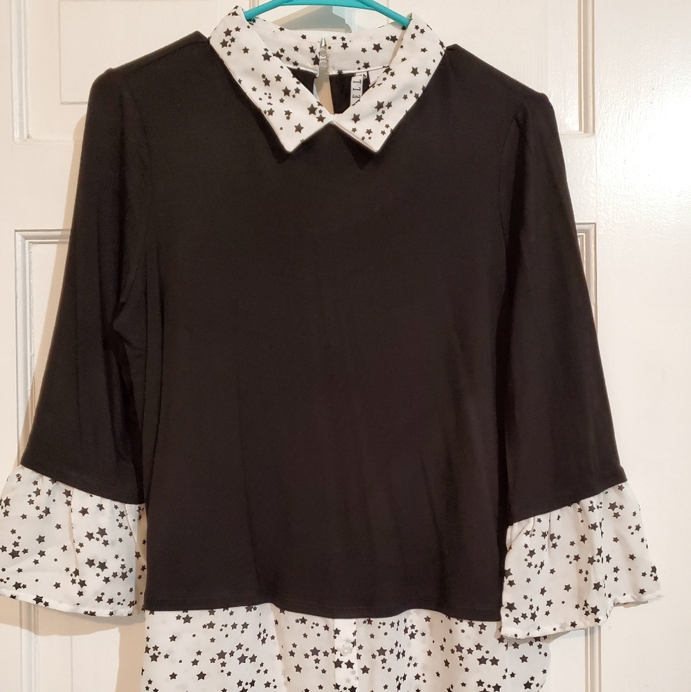 Black top with white sleeves,  collar
